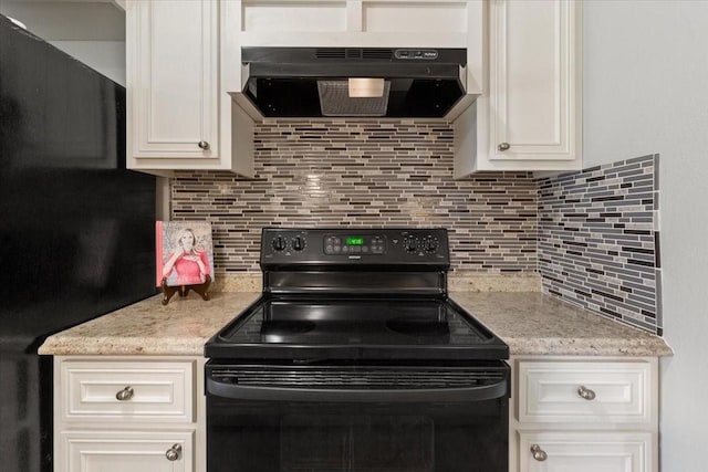 kitchen with range hood, black electric range, tasteful backsplash, and white cabinets