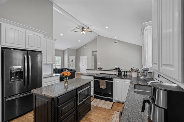 3407 Holbrook Rd, Springtown, TX 76082 - kitchen with fridge with ice dispenser, stainless steel microwave, black / electric stove, white cabinetry, and ceiling fan