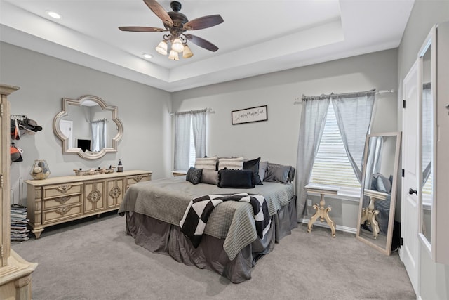 3407 Holbrook Rd, Springtown, TX 76082 - bedroom featuring light carpet, baseboards, a tray ceiling, recessed lighting, and a ceiling fan