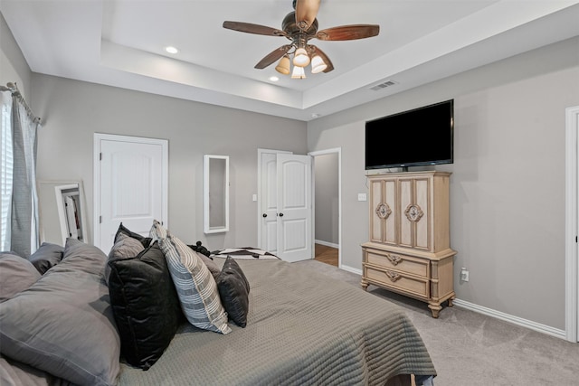 3407 Holbrook Rd, Springtown, TX 76082 - bedroom featuring light carpet, baseboards, a tray ceiling, recessed lighting, and ceiling fan