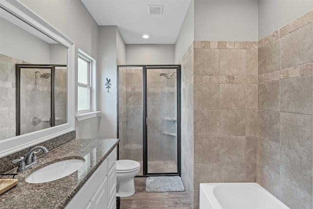 3407 Holbrook Rd, Springtown, TX 76082 - bathroom with wood finished floors, a shower stall, toilet, and vanity