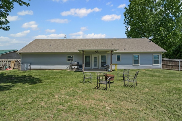 3407 Holbrook Rd, Springtown, TX 76082 - back of property with a ceiling fan, cooling unit, roof with shingles, and a patio