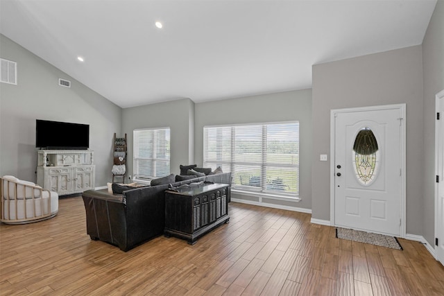 3407 Holbrook Rd, Springtown, TX 76082 - living room with light wood finished floors, baseboards, recessed lighting, and high vaulted ceiling
