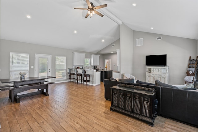 3407 Holbrook Rd, Springtown, TX 76082 - living room with a ceiling fan, high vaulted ceiling, light wood-style flooring, recessed lighting, and beam ceiling