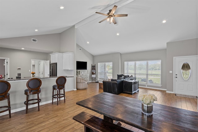 3407 Holbrook Rd, Springtown, TX 76082 - dining room with high vaulted ceiling, a ceiling fan, light wood-style flooring, baseboards, and recessed lighting