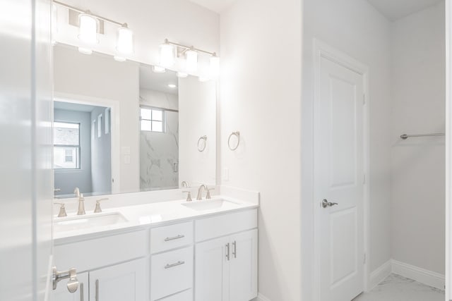 9709 Thorncrown Ln, Fort Worth, TX 76179 - full bathroom featuring marble finish floors, a marble finish shower, baseboards, and double vanity