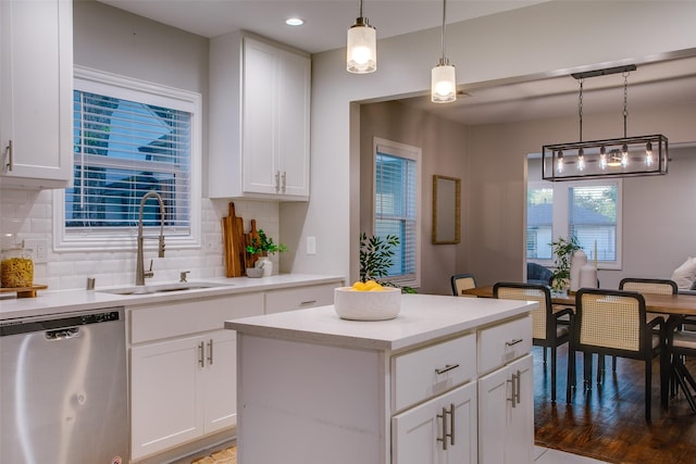 1300 Mountain Lake Rd, Dallas, TX 75224 - kitchen featuring stainless steel dishwasher, a sink, tasteful backsplash, white cabinetry, and light countertops