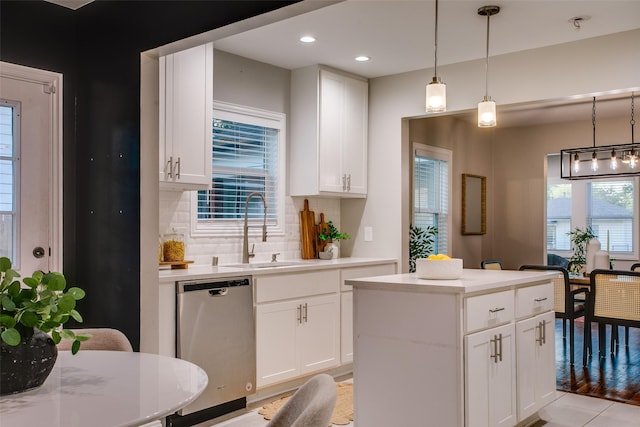 1300 Mountain Lake Rd, Dallas, TX 75224 - kitchen with dishwasher, a sink, tasteful backsplash, a kitchen island, and light countertops