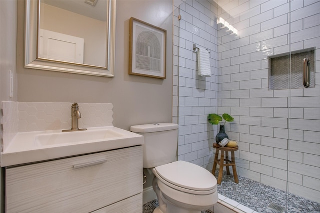 1300 Mountain Lake Rd, Dallas, TX 75224 - bathroom with toilet, a shower stall, vanity, and tasteful backsplash