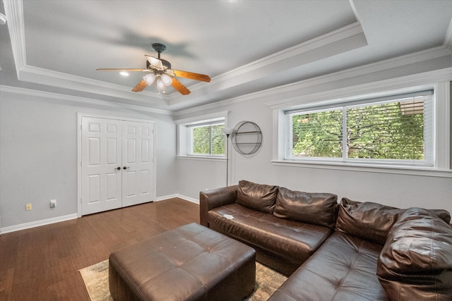 1304 Brook Arbor Dr, Mansfield, TX 76063 - living room with a raised ceiling, dark wood-type flooring, a ceiling fan, baseboards, and crown molding