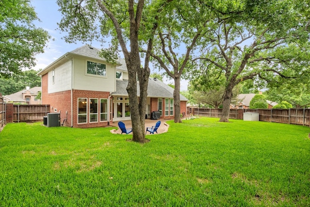1304 Brook Arbor Dr, Mansfield, TX 76063 - back of property with brick siding, central air condition unit, and roof with shingles