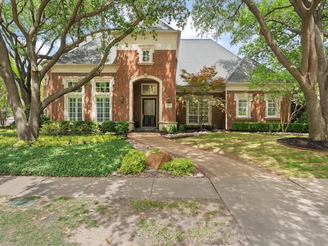 5916 Orchard Park Dr, Frisco, TX 75034 - traditional home featuring brick siding and a front lawn