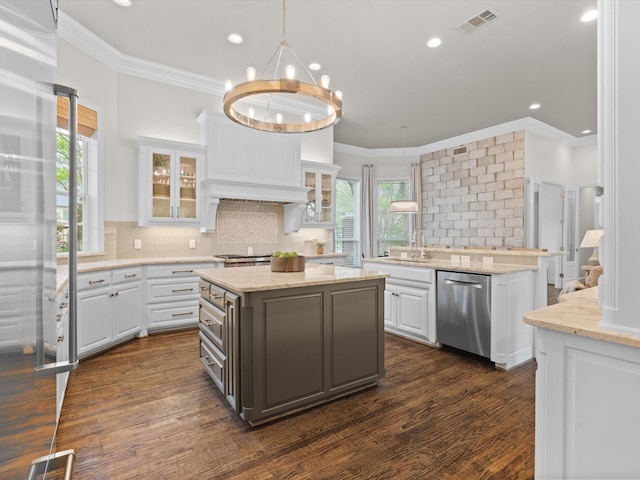 5916 Orchard Park Dr, Frisco, TX 75034 - kitchen with stainless steel dishwasher, white cabinets, a center island, a sink, and backsplash