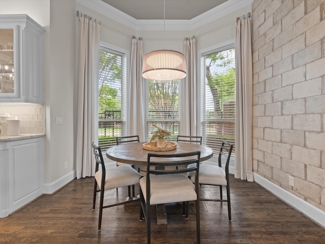 5916 Orchard Park Dr, Frisco, TX 75034 - dining area featuring dark wood-style flooring, plenty of natural light, crown molding, and baseboards