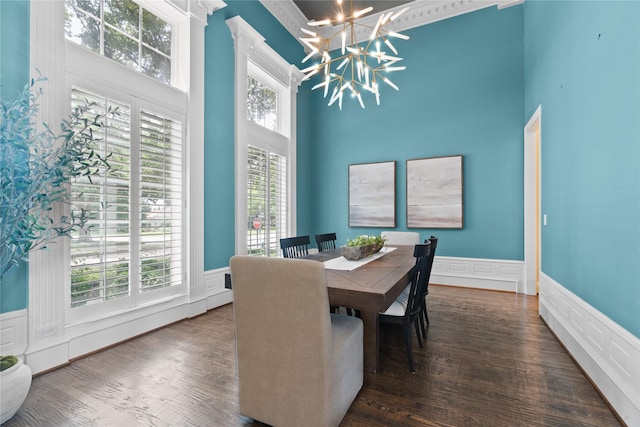 5916 Orchard Park Dr, Frisco, TX 75034 - dining room with a high ceiling, wainscoting, a chandelier, a decorative wall, and healthy amount of natural light