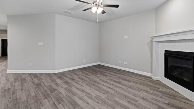 1913 Brindle St, Northlake, TX 76247 - unfurnished living room with a ceiling fan, baseboards, wood finished floors, and a fireplace
