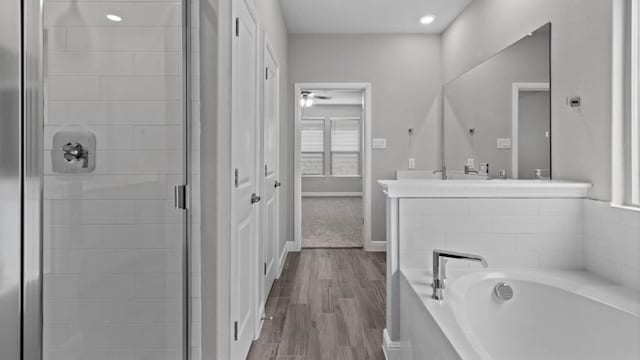 1913 Brindle St, Northlake, TX 76247 - full bath with a stall shower, a bath, wood finished floors, vanity, and baseboards