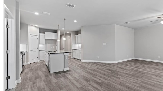 1913 Brindle St, Northlake, TX 76247 - kitchen with open floor plan, a sink, light wood-type flooring, white cabinets, and recessed lighting
