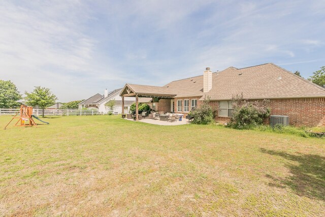 1132 Mount Ln, Rhome, TX 76078 - view of yard featuring a patio, cooling unit, a playground, and an outdoor hangout area