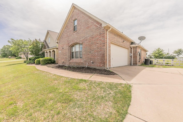 1132 Mount Ln, Rhome, TX 76078 - view of side of property with brick siding, concrete driveway, and an attached garage