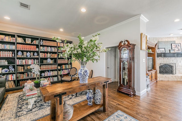 1132 Mount Ln, Rhome, TX 76078 - office area featuring ornamental molding, wood finished floors, recessed lighting, baseboards, and a stone fireplace