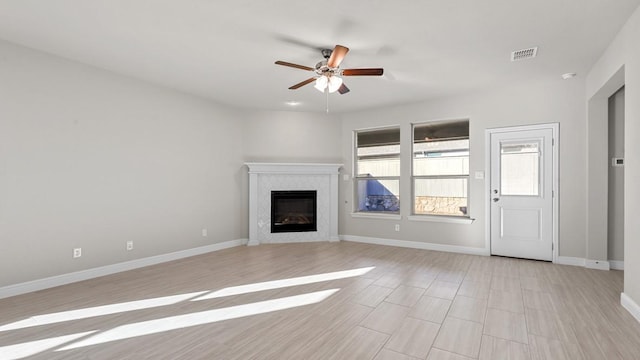 1900 Stetson St, Northlake, TX 76247 - unfurnished living room with a ceiling fan, baseboards, and a glass covered fireplace