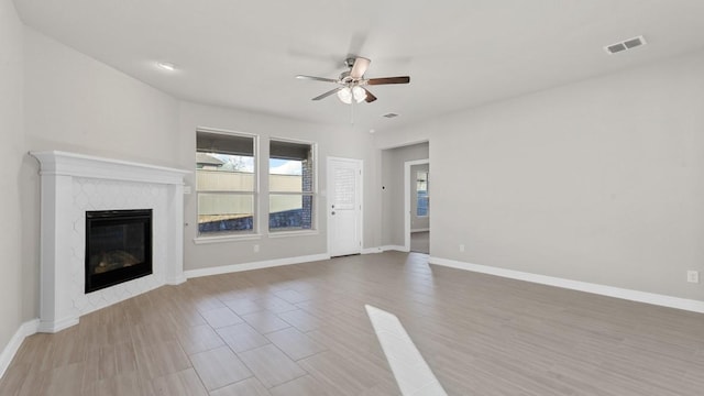 1900 Stetson St, Northlake, TX 76247 - unfurnished living room with a ceiling fan, a fireplace, baseboards, and wood finished floors