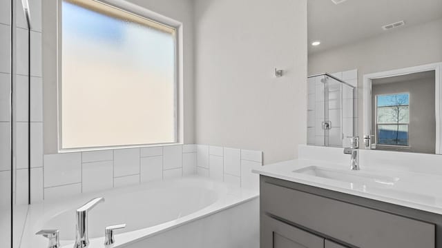 1900 Stetson St, Northlake, TX 76247 - bathroom with a shower stall, a bath, vanity, and recessed lighting