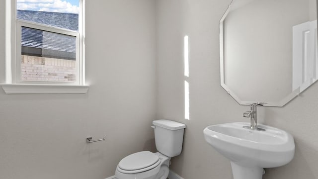 1900 Stetson St, Northlake, TX 76247 - bathroom featuring baseboards, toilet, and a sink