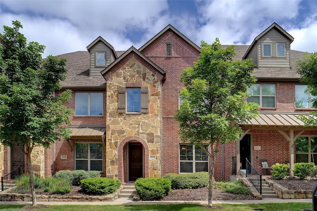 7132 Huckleberry Dr, Mckinney, TX 75070 - view of front of property with stone siding, roof with shingles, and brick siding