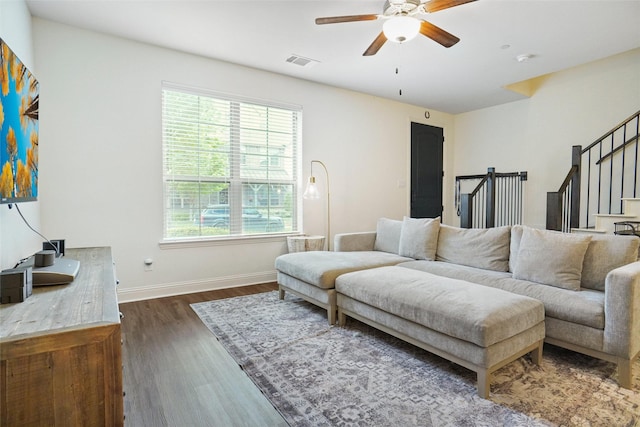 7132 Huckleberry Dr, Mckinney, TX 75070 - living area featuring ceiling fan, dark wood-type flooring, baseboards, and stairs