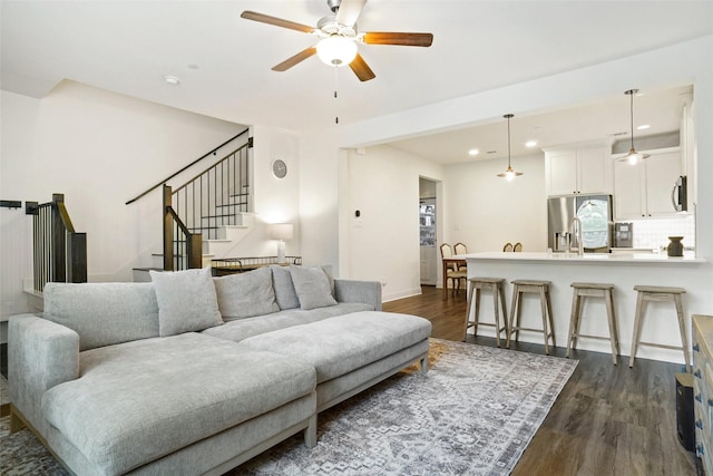7132 Huckleberry Dr, Mckinney, TX 75070 - living room featuring dark wood finished floors, a ceiling fan, stairs, recessed lighting, and baseboards