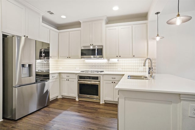 7132 Huckleberry Dr, Mckinney, TX 75070 - kitchen with stainless steel appliances, a sink, decorative backsplash, light countertops, and white cabinets