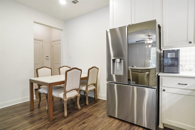 7132 Huckleberry Dr, Mckinney, TX 75070 - kitchen featuring stainless steel fridge, dark wood finished floors, baseboards, and white cabinetry