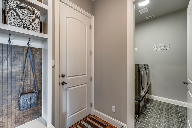 6470 Eyrie Bnd, Waxahachie, TX 75167 - clothes washing area with separate washer and dryer, baseboards, and dark tile patterned floors