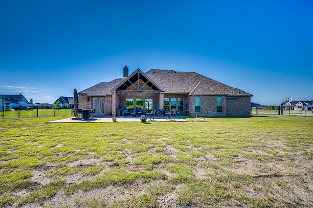 6470 Eyrie Bnd, Waxahachie, TX 75167 - rear view of house featuring a patio area, brick siding, and a chimney