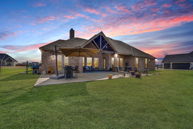 6470 Eyrie Bnd, Waxahachie, TX 75167 - rear view of house featuring brick siding, a patio, a fire pit, and a chimney