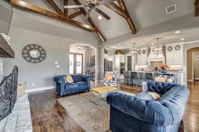 6470 Eyrie Bnd, Waxahachie, TX 75167 - living room featuring arched walkways, high vaulted ceiling, beamed ceiling, recessed lighting, and baseboards