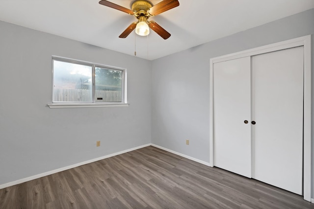 7357 Channel View Dr, Fort Worth, TX 76133 - unfurnished bedroom featuring wood finished floors, a closet, baseboards, and a ceiling fan