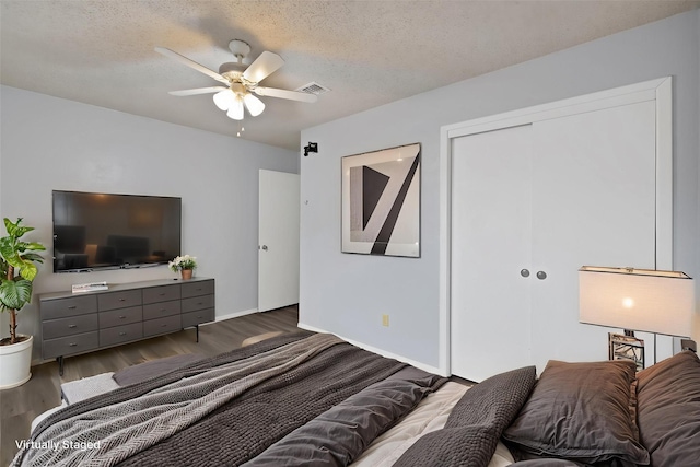 7357 Channel View Dr, Fort Worth, TX 76133 - bedroom with a closet, wood finished floors, a textured ceiling, and ceiling fan