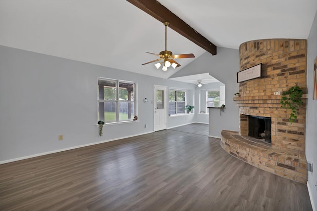 7357 Channel View Dr, Fort Worth, TX 76133 - unfurnished living room with a ceiling fan, dark wood finished floors, a brick fireplace, and baseboards