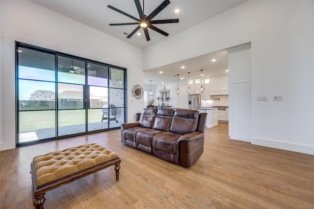 145 Chisolm Trl, Pottsboro, TX 75076 - living area with ceiling fan, light wood finished floors, a high ceiling, recessed lighting, and baseboards