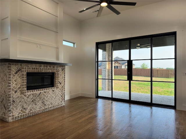 145 Chisolm Trl, Pottsboro, TX 75076 - unfurnished living room with a ceiling fan, wood finished floors, and plenty of natural light