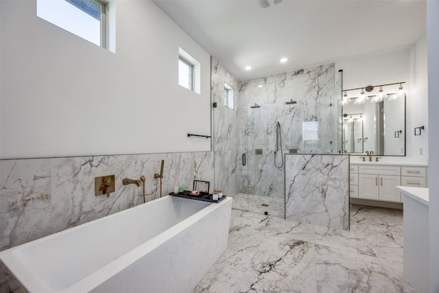 145 Chisolm Trl, Pottsboro, TX 75076 - full bathroom with a marble finish shower, a freestanding tub, vanity, marble tiled flooring, and recessed lighting