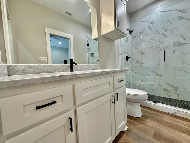 913 Carter, Sulphur Springs, TX 75482 - full bath featuring a shower stall, toilet, vanity, and wood finished floors