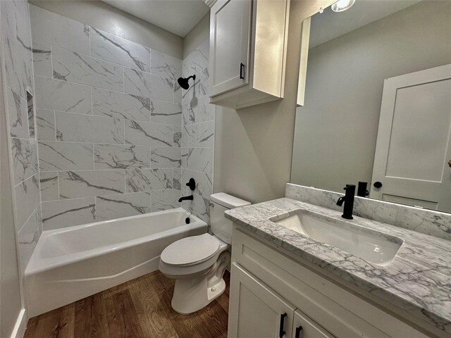 913 Carter, Sulphur Springs, TX 75482 - full bath featuring wood finished floors, toilet, tub / shower combination, and vanity