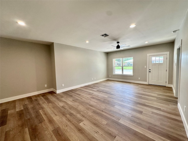 913 Carter, Sulphur Springs, TX 75482 - unfurnished living room with a ceiling fan, wood finished floors, recessed lighting, and baseboards