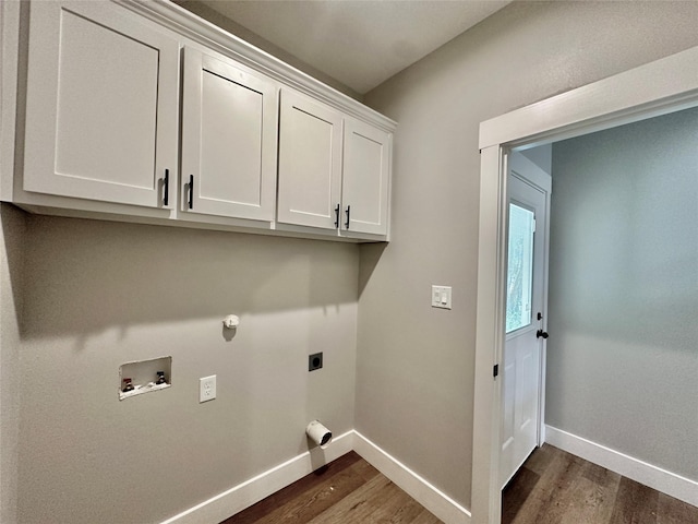 913 Carter, Sulphur Springs, TX 75482 - washroom with dark wood-style floors, cabinet space, electric dryer hookup, and baseboards