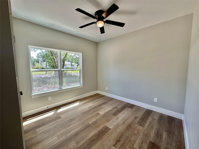 913 Carter, Sulphur Springs, TX 75482 - empty room with wood finished floors, a ceiling fan, and baseboards