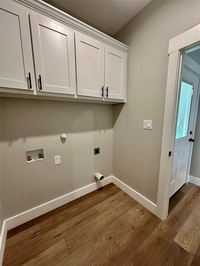 913 Carter, Sulphur Springs, TX 75482 - washroom with dark wood finished floors, baseboards, electric dryer hookup, washer hookup, and cabinet space